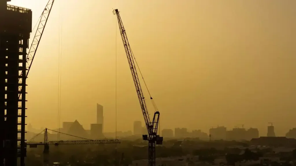 Construction cranes illustrating off-plan property development in Dubai